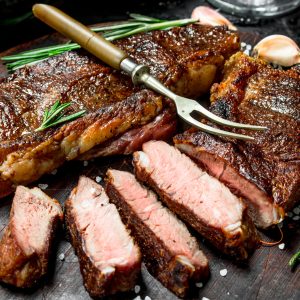 Grilled beef steak with rosemary and spices.